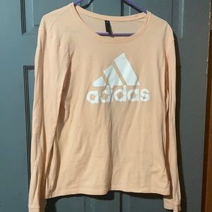 Women’s size medium peach long sleeve shirt.